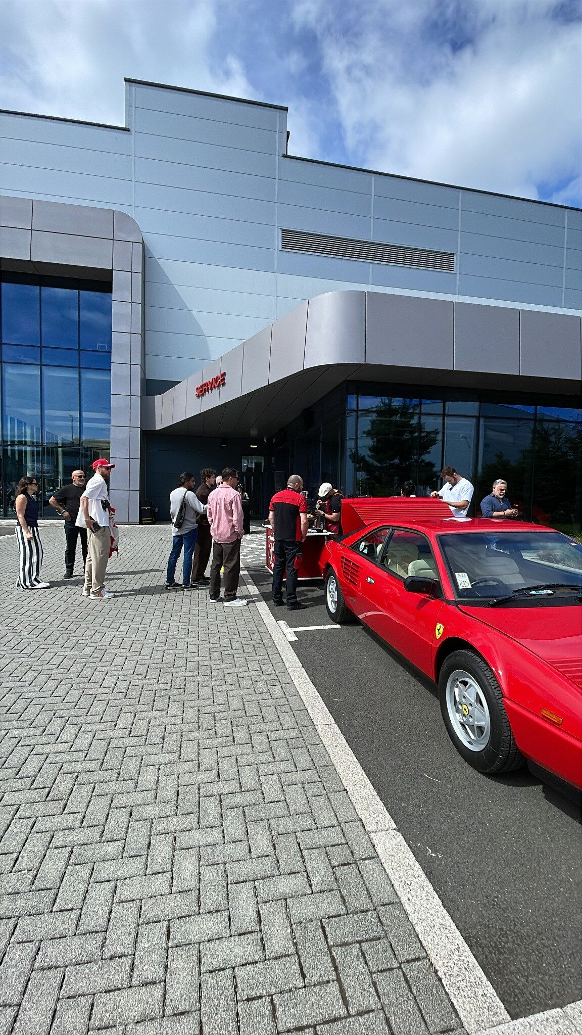 V80 Caffè serving guests at an automotive event
